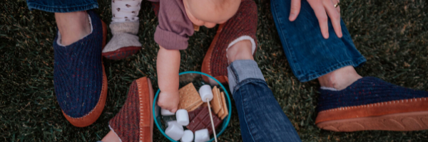 Family enjoying marshmallows in acorn slippers