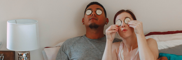 couple with cucumbers on eyes