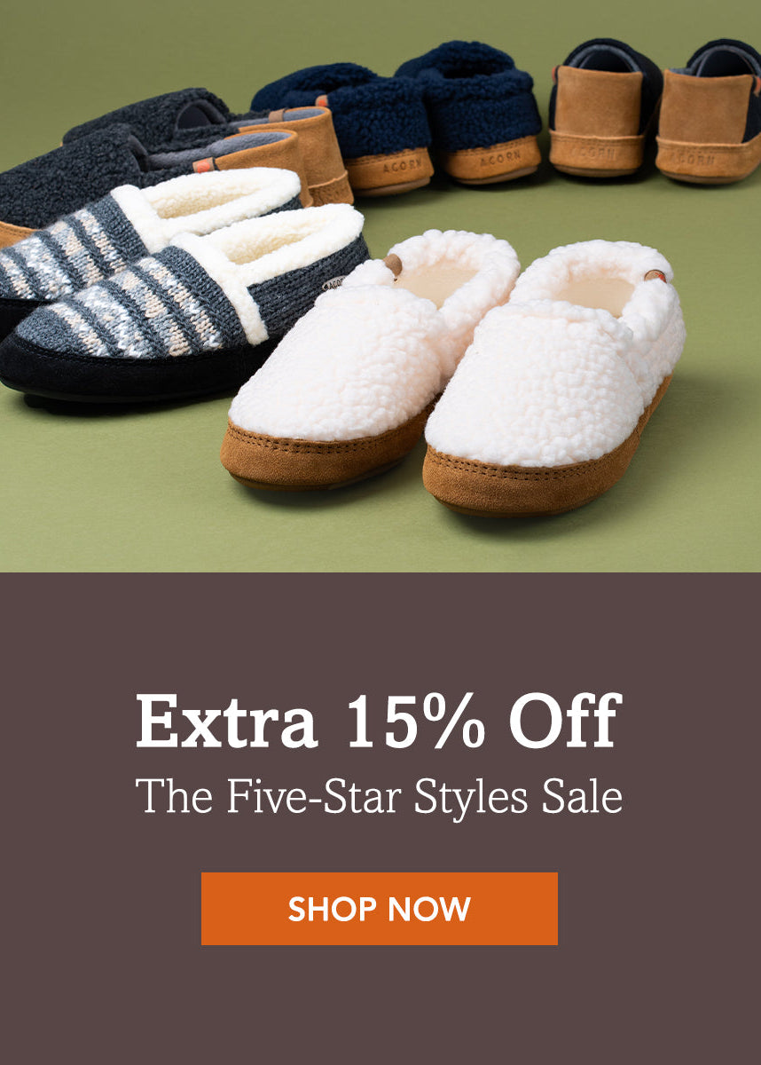 Pair of slippers with promotional text for an extra 15% off sale on a green background