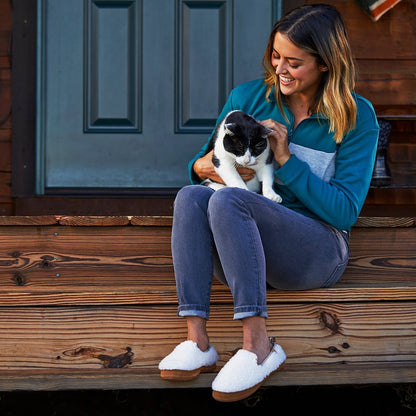 Women’s Lightweight Bristol Loafer in Buff Popcorn on model sitting on the stairs of a porch holding a cat