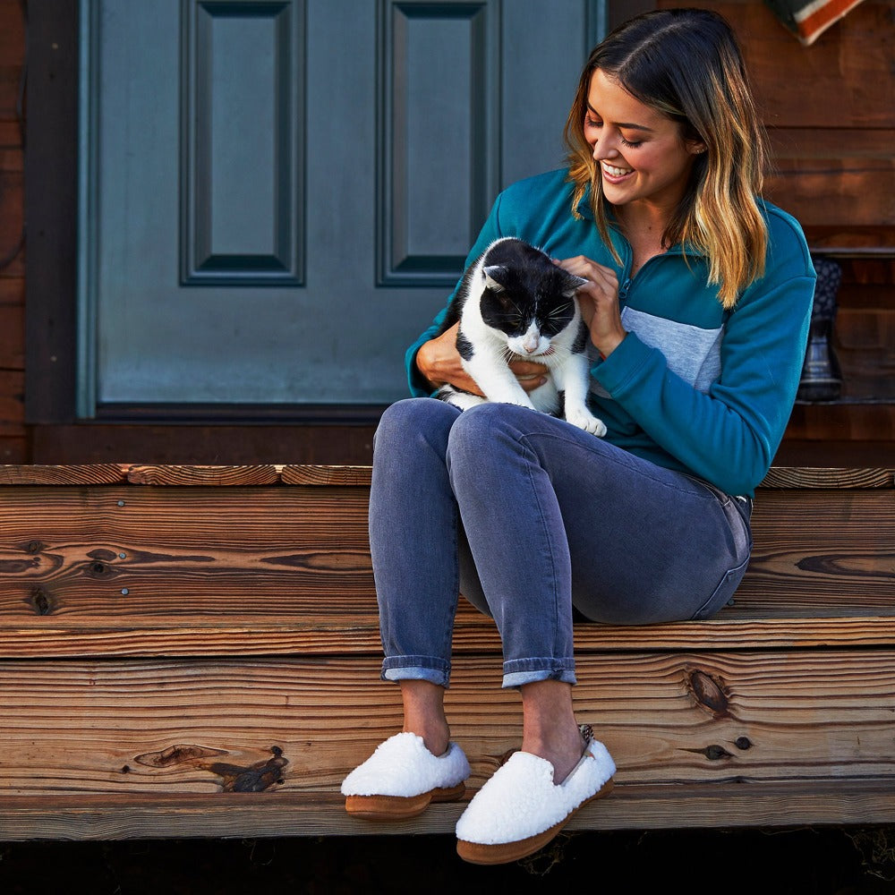 Women’s Lightweight Bristol Loafer in Buff Popcorn on model sitting on the stairs of a porch holding a cat