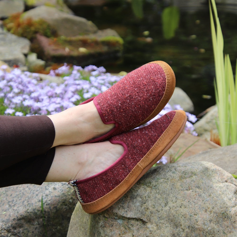 Women's Lightweight Bristol Loafer in Copper on model sitting with their feet up on a rock by a koi pond #color_black